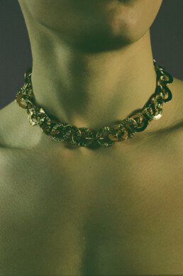 Male bust wearing a vintage Chanel costume Jewelry