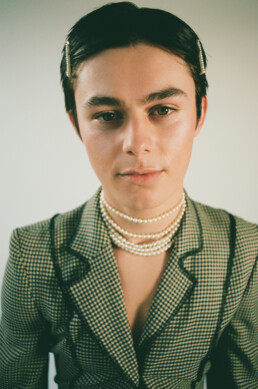 Young male in studio wearing vintage Moschino.